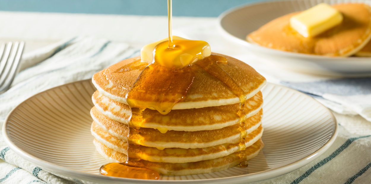Sweet Homemade Stack of Pancakes with Butter and Syrup for Breakfast
